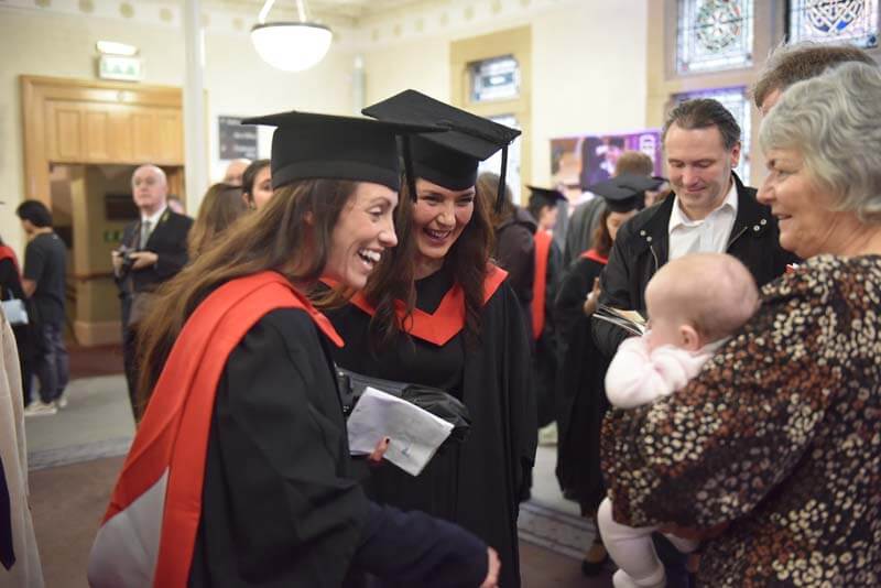 two graduates at the graduation after completing dance teaching qualifications with the RAD